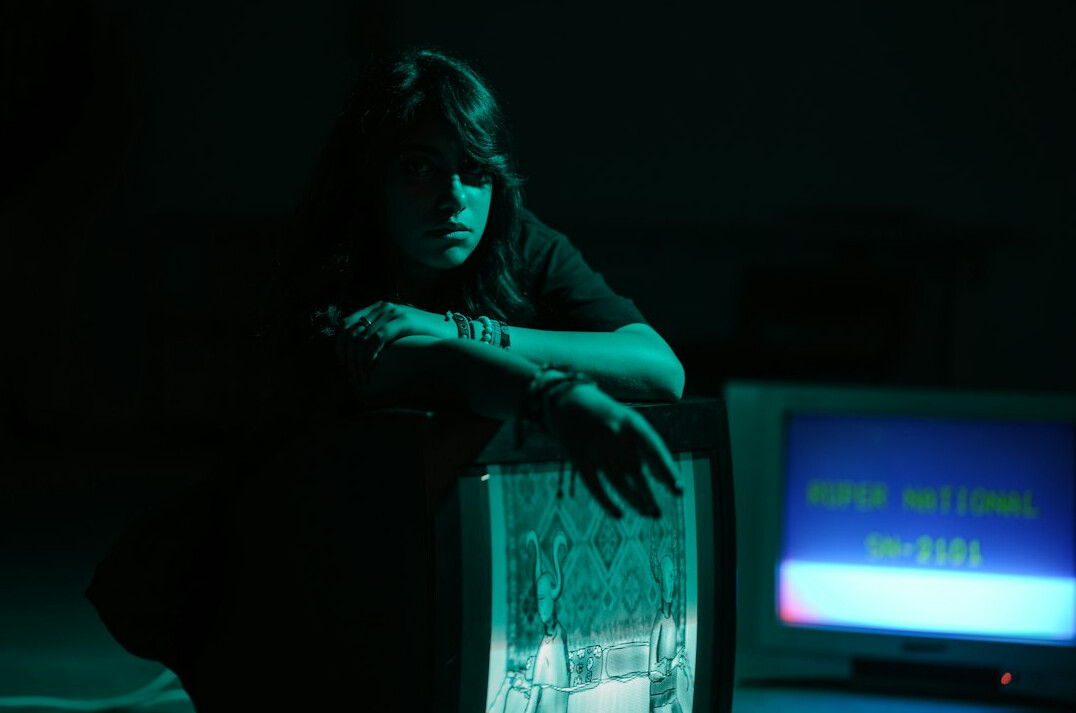 Vintage television set glowing in a dark room, evoking 1980s advertising broadcasts